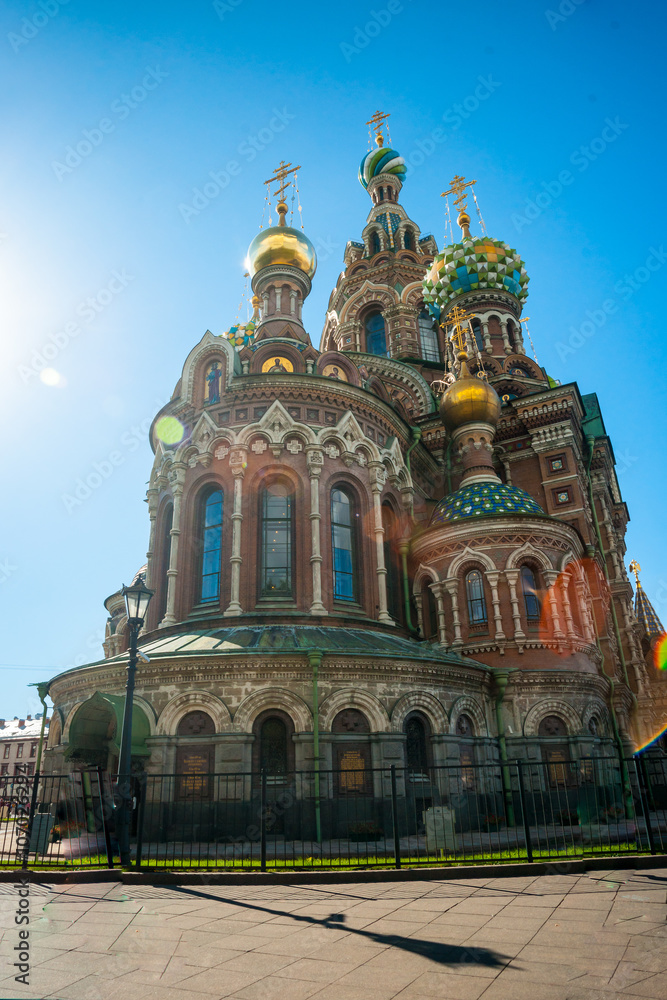 Church of the Savior on Blood against bright sun with lens flare in Saint-Petersburg, Russia. One of the main touristic attractions in the city.