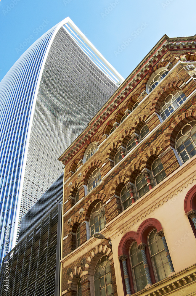 Obraz premium Old building among modern buildings in London, England