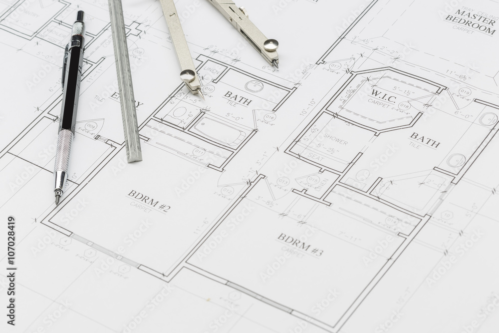 Engineer Pencil, Ruler and Compass Resting on House Plans Engineer Pencil, Ruler and Compass Resting on House Plans