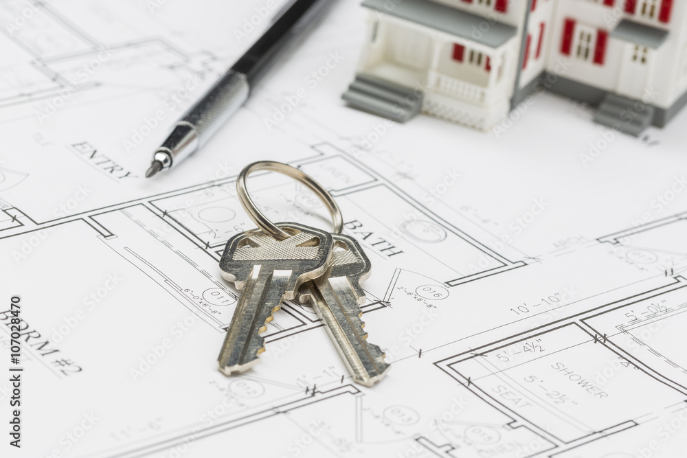 Model Home, Engineer Pencil and Keys Resting on House Plans Model Home, Engineer Pencil and Keys Resting on House Plans