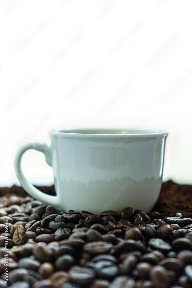 Cup of Coffee in heap of Coffee Beans Cup of Coffee in heap of Coffee Beans