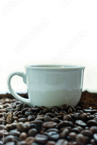 Cup of Coffee in heap of Coffee Beans
