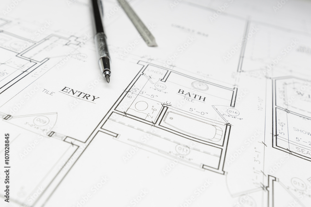 Engineer Pencil and Ruler Resting on House Plans Engineer Pencil and Ruler Resting on House Plans