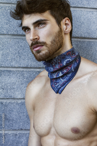 Canvastavla Close up of handsome man with long beard and blue scarf around his neck