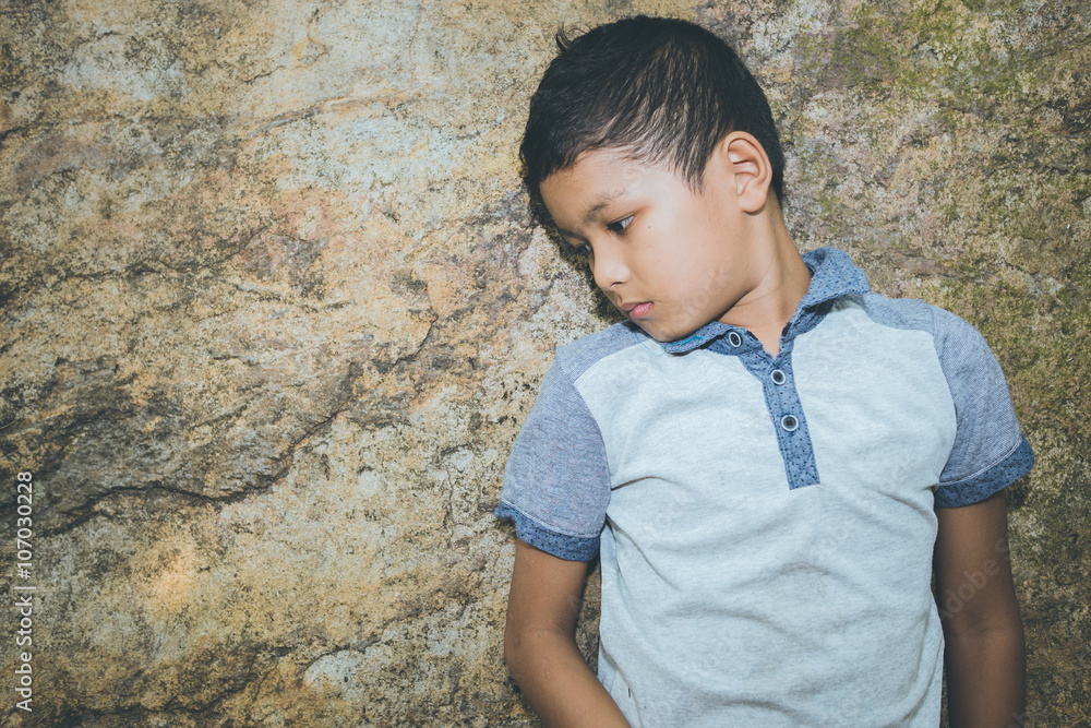 scared and alone, young Asian child who is at high risk of being bullied, trafficked and abused, selective focus scared and alone, young Asian child who is at high risk of being bullied, trafficked and abused, selective focus