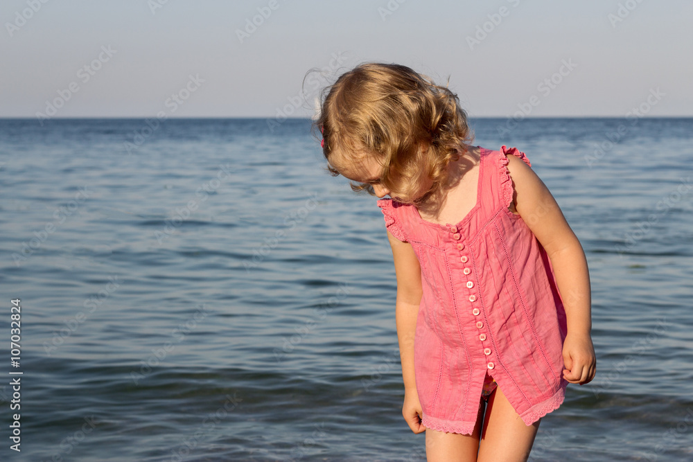 Happy, funny little girl on the sea. Happy, funny little girl on the sea.