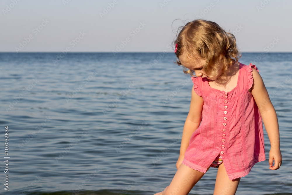 Happy, funny little girl on the sea. Happy, funny little girl on the sea.