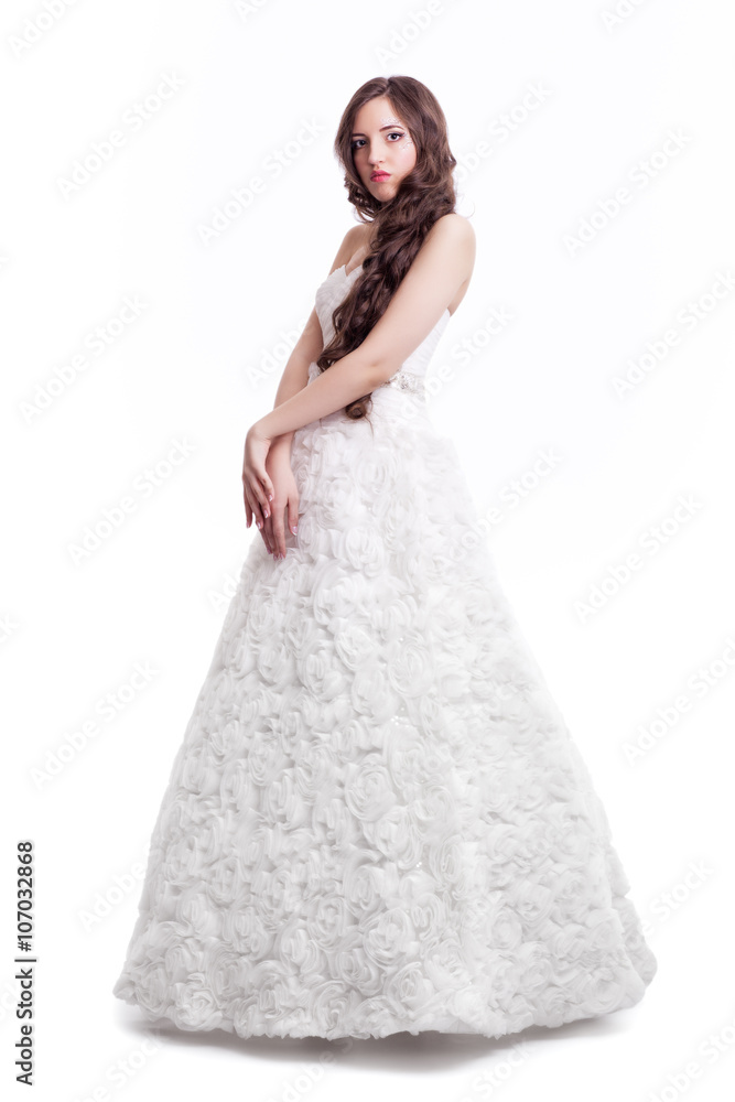 Portrait of beautiful young brunette woman bride  in white Weddi