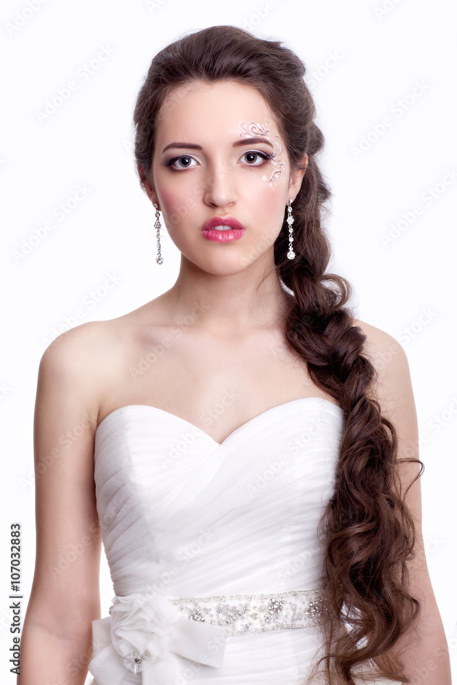 Portrait of beautiful young brunette woman bride  in white Weddi