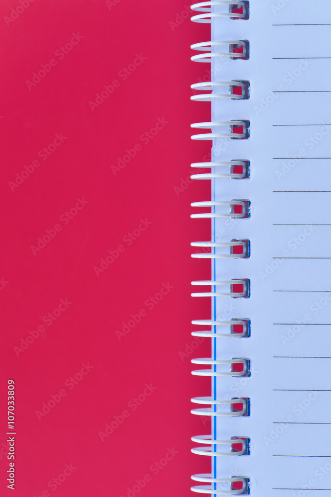 White notebook with vertical red page