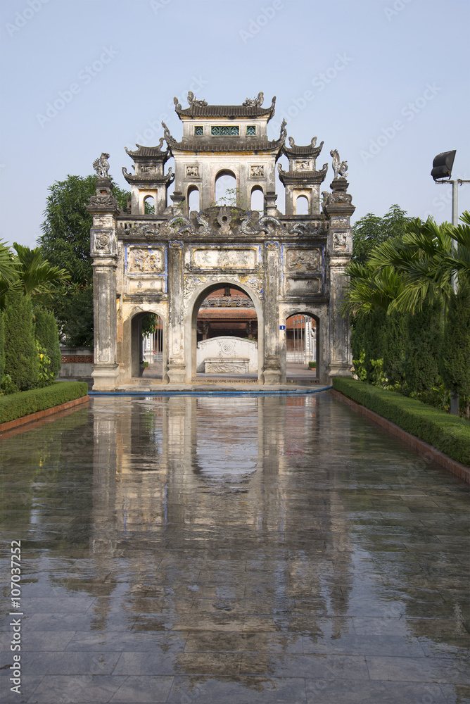 The gate of a Buddhist temple in Snake village (Le Mat) early in the morning. Vietnam