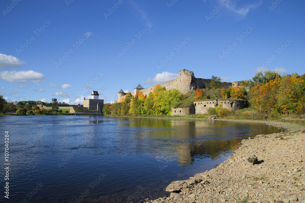 Sunny september day on the river Narova. View of the Ivangorod fortress and the castle of Hermann