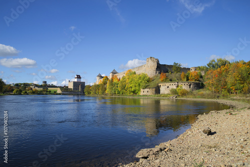 Sunny september day on the river Narova. View of the Ivangorod fortress and the castle of Hermann