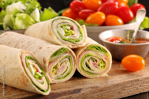 Fresh tortilla wraps with ham cheese and vegetables
