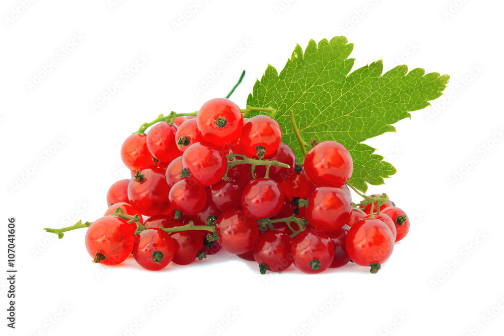 Heap of red ripe currant with leaves isolated on a white Heap of red ripe currant with leaves isolated on a white