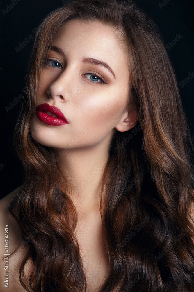 High fashion look.glamor closeup portrait of beautiful sexy stylish brunette young woman model with bright makeup with red lips.Beautiful girl with red lips on black Background. Gorgeous Woman Face. High fashion look.glamor closeup portrait of beautiful sexy stylish brunette young woman model with bright makeup with red lips.Beautiful girl with red lips on black Background. Gorgeous Woman Face.
