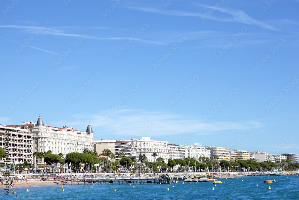 Cannes beach and croisette seafront with famous hotels along the promenade french riviera photo