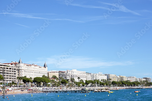 Cannes beach and croisette seafront with famous hotels along the promenade french riviera photo