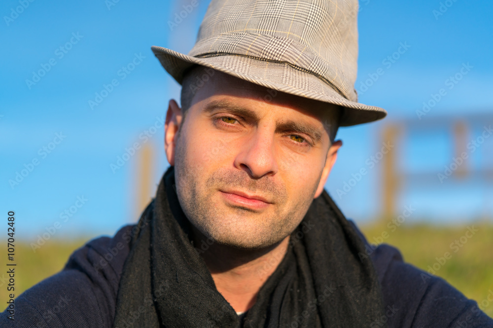 Man in hat looking at camera