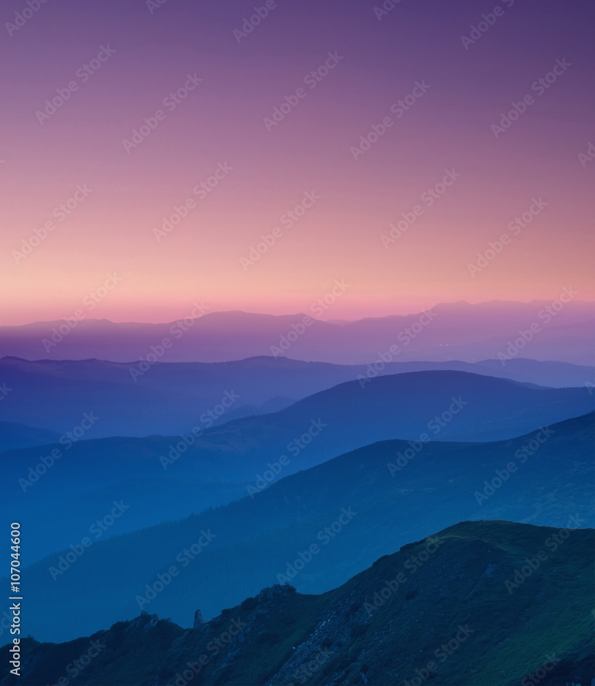 Hills lines in mountain valley during sunset. Natural summer mountain landscape
