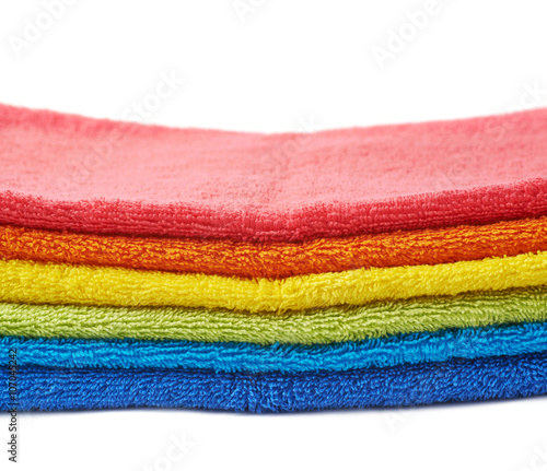 Rainbow colored pile of towels isolated