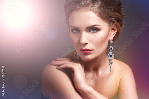 Beautiful woman with evening make-up. Jewelry and Beauty. Fashion photo
