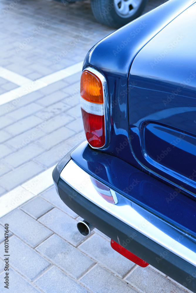 Backlights of an antique car. Close of the back of a classic car