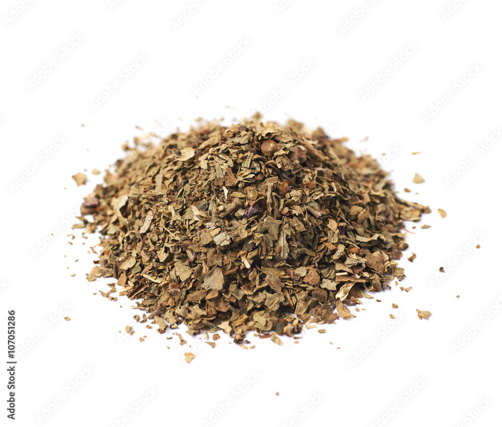 Pile of dried basil seasoning isolated Pile of dried basil seasoning isolated
