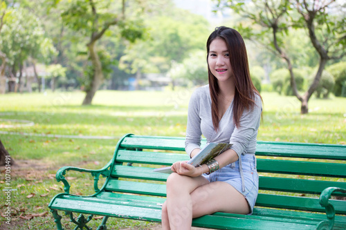 Portrait of thai adult beautiful girl read a book