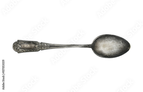 old vintage silver spoon with ornament isolated on white background