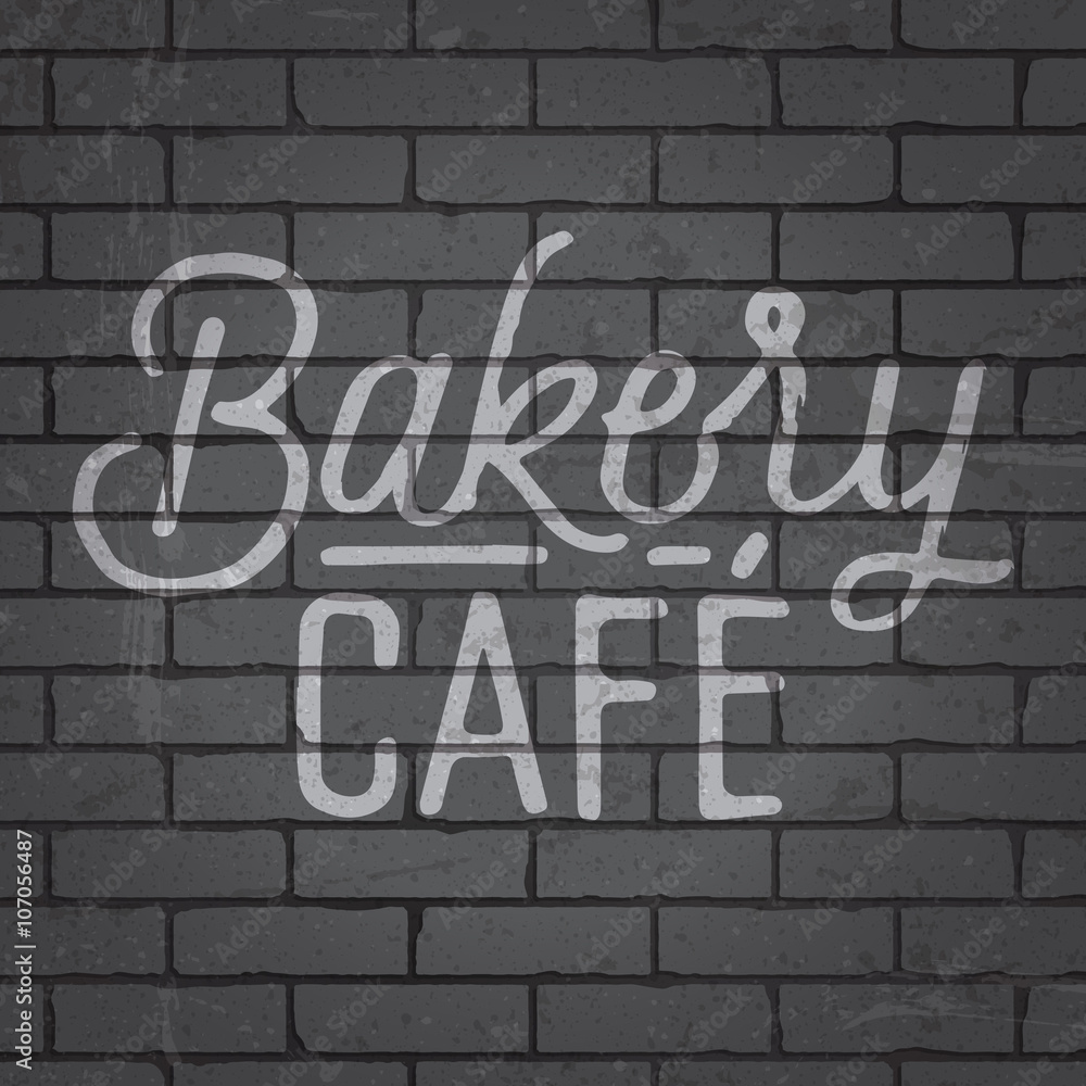 Hand drawn lettering slogan on brick wall background Hand drawn lettering slogan on brick wall background