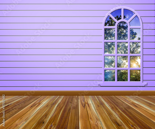 Empty room with wood floors and windows.