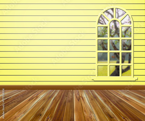 Empty room with wood floors and windows.