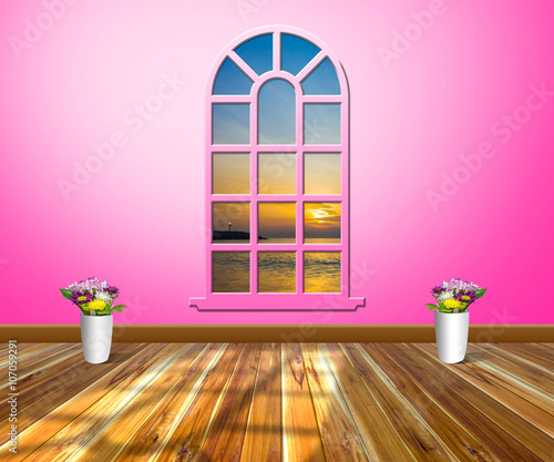 Empty room with wood floors and windows.