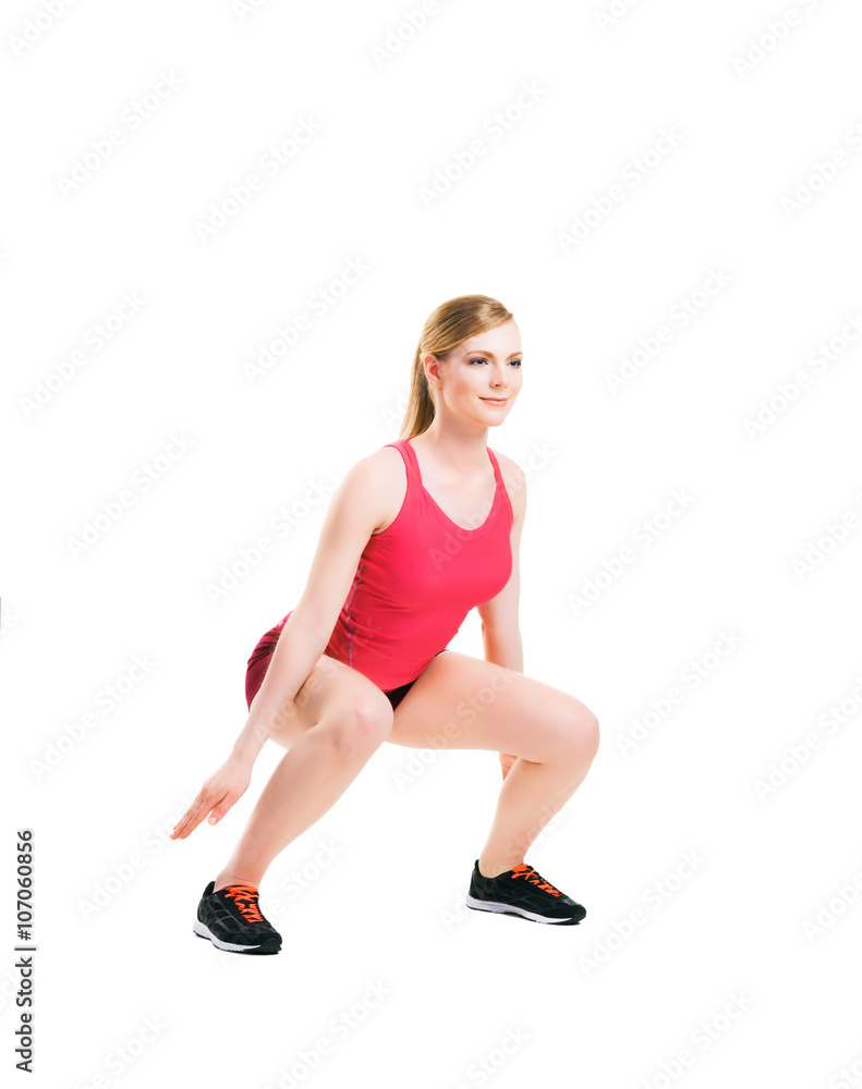 Fit woman in sportswear doing physical exercises Fit woman in sportswear doing physical exercises