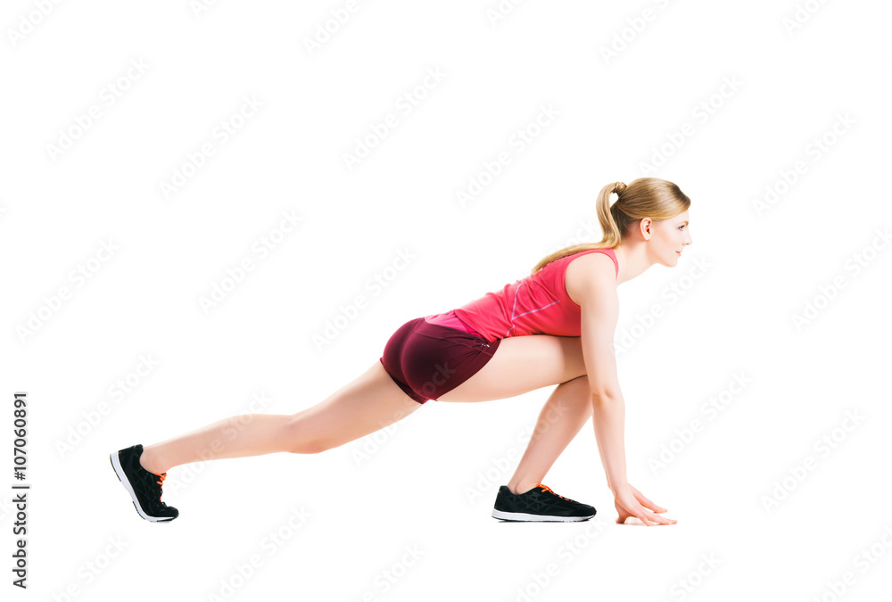Fit woman in sportswear doing physical exercises