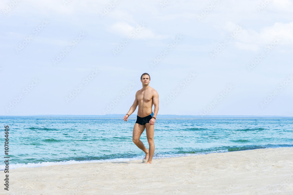 Young, fit handsome man on a summer beach Young, fit handsome man on a summer beach