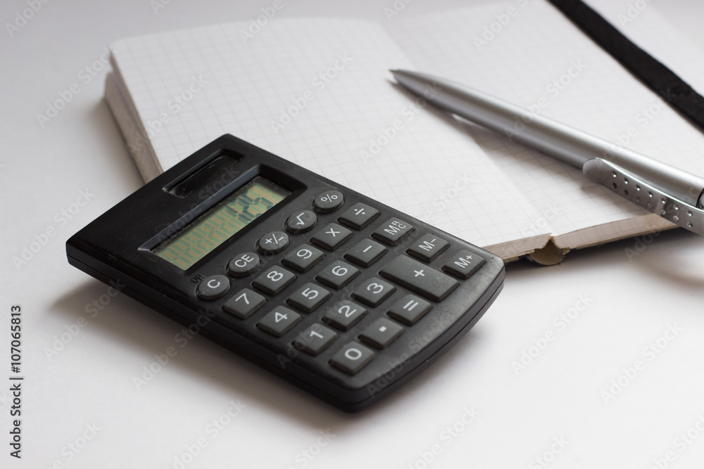 Business Concept with calculator, notebook and pen Business Concept with calculator, notebook and pen
