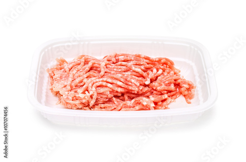 ground pork in plastic tray isolated on white background