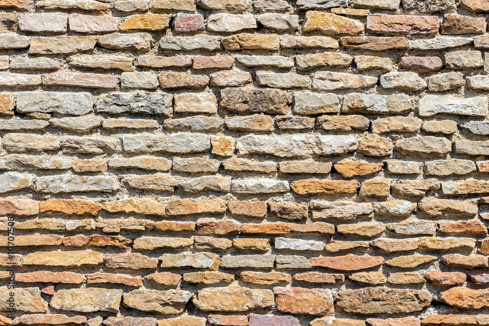 Fototapeta premium Brown masonry rock wall