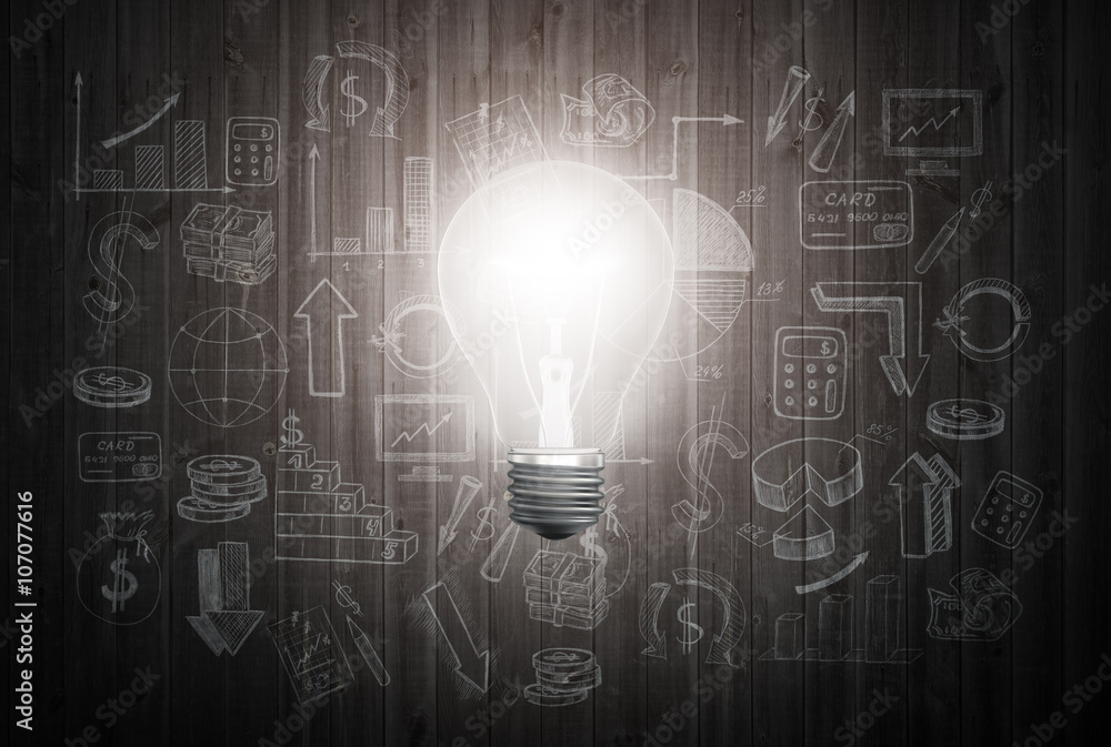 Glowing light bulb on wooden wall with drawing charts and graphs about business success strategy plan Glowing light bulb on wooden wall with drawing charts and graphs about business success strategy plan