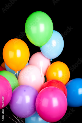 Group of colorful balloons isolated on black