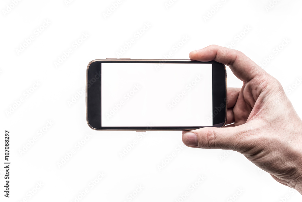 Hand holding mobile smartphone with blank screen horizontally on white ...