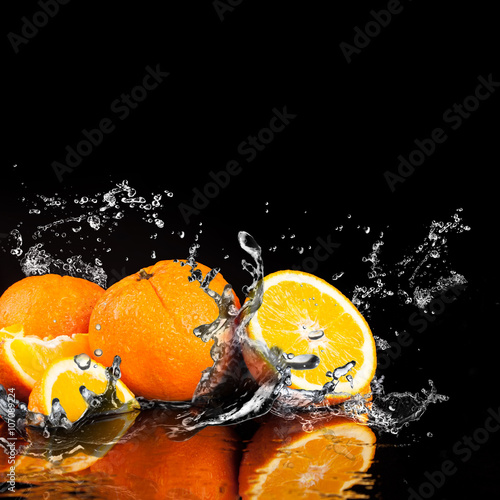 Orange fruits and Splashing water