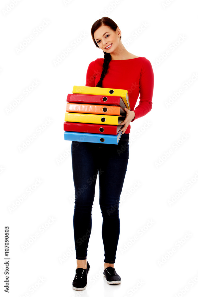 Young happy woman holding binders Young happy woman holding binders