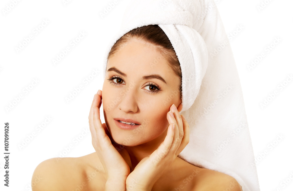 Young happy woman touching her face Young happy woman touching her face