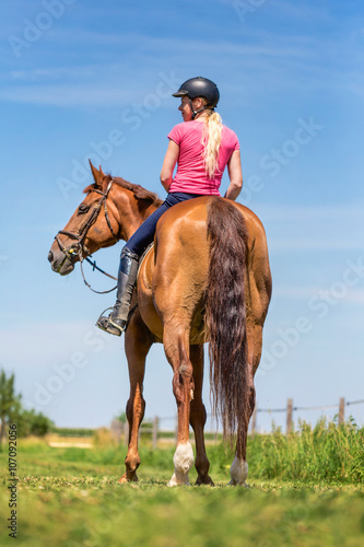 Girl sitting on a horse