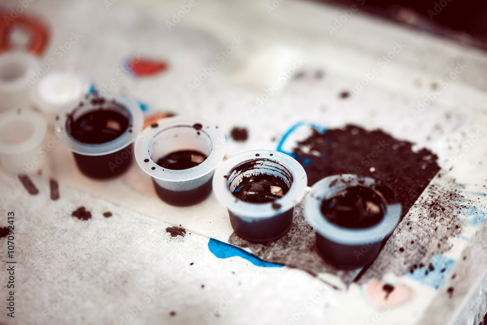 A special paint for doing the tattoo. Preparation of master tattoo artist to work A special paint for doing the tattoo. Preparation of master tattoo artist to work