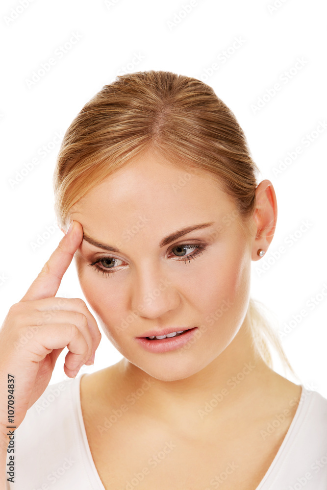 Pensive young woman thinking about something Pensive young woman thinking about something
