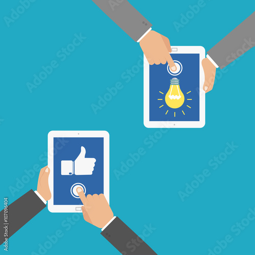 Website rating feedback and review concept. Hand holding and pointing to a tablet with like hand sign button on the screen. Hand holding tablet with idea concept.